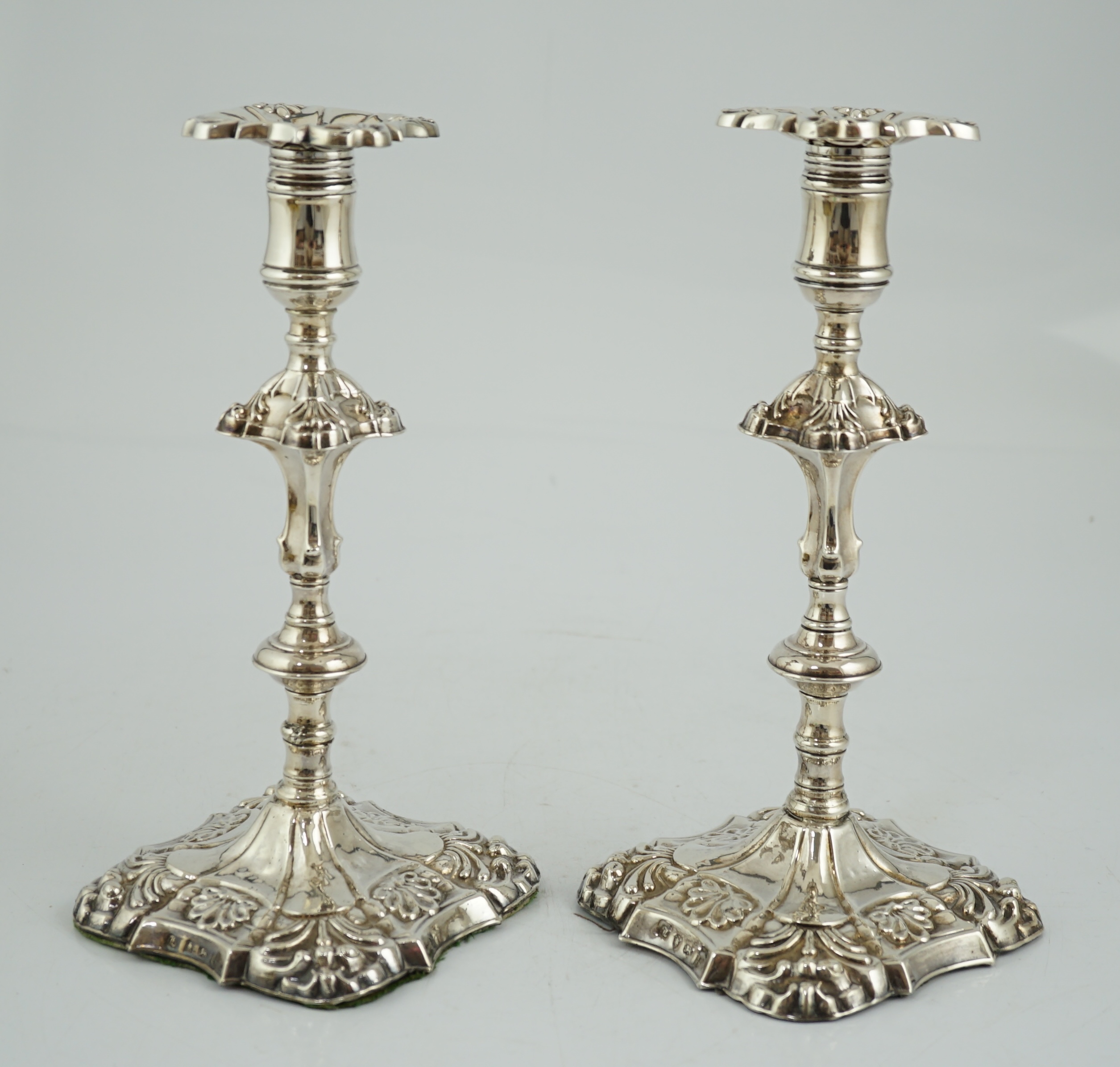 A pair of early George III silver candlesticks, by James Stamp & John Baker